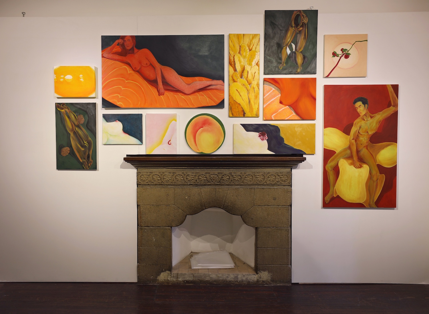 A wall full of paintings.