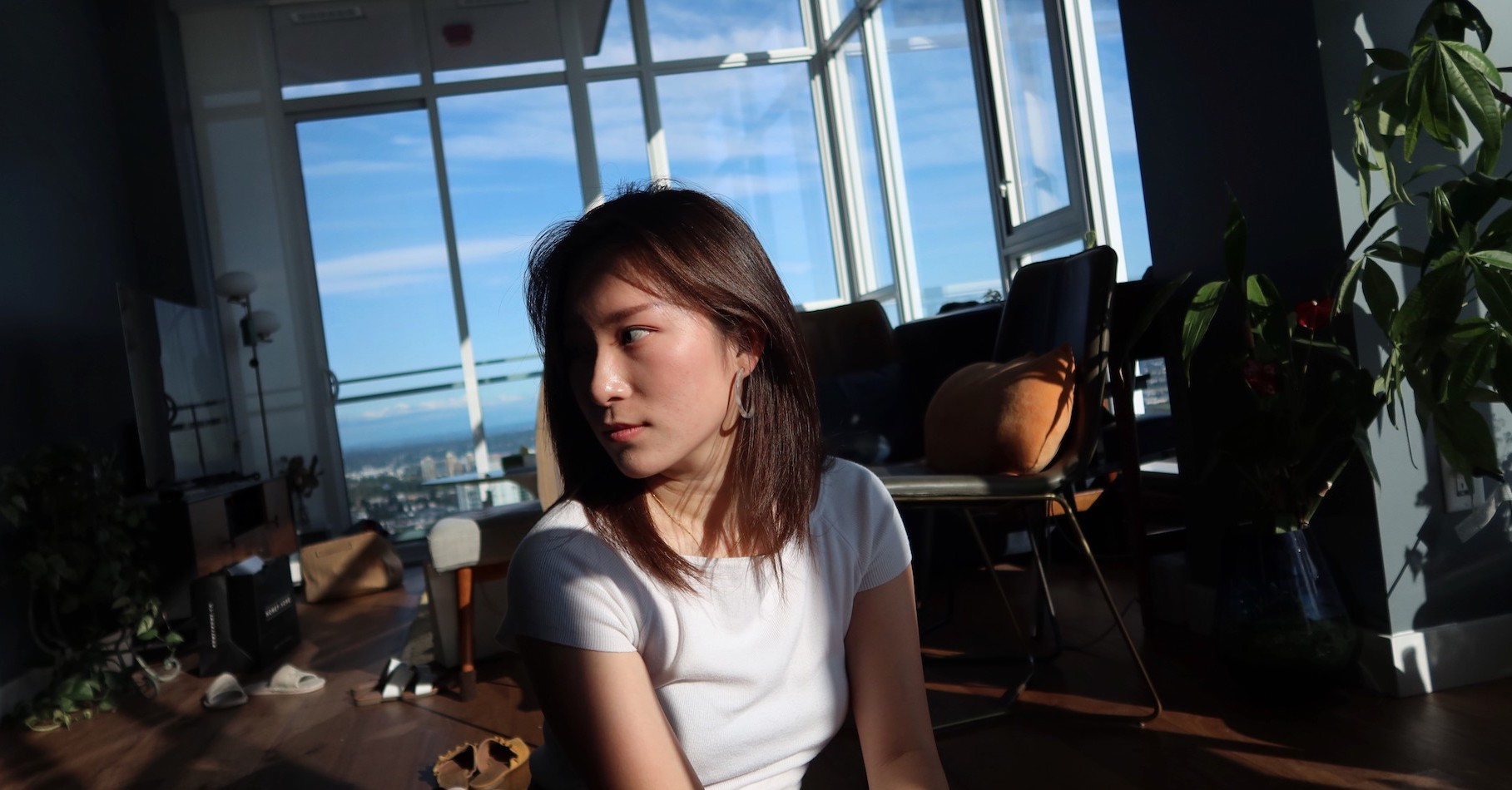 A woman looking at the catalogue in front of the artwork